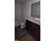 Bathroom features a vanity, mirror, toilet and shower/bath at 937 Emmer St, Rolesville, NC 27571