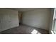 A cozy bedroom features neutral carpet and walls, plus a double door closet at 937 Emmer St, Rolesville, NC 27571