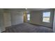 Neutral bedroom with two windows and carpet; view of the outside at 937 Emmer St, Rolesville, NC 27571