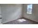 Bedroom with gray carpet, white walls and a window offering outdoor views at 937 Emmer St, Rolesville, NC 27571