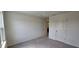 Carpeted bedroom with two doors and a window at 937 Emmer St, Rolesville, NC 27571