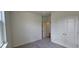 Neutral bedroom featuring gray carpet, white walls, and a closet at 937 Emmer St, Rolesville, NC 27571