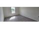 Bedroom with carpet, light-colored walls, and a window at 937 Emmer St, Rolesville, NC 27571