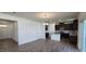 Bright living space with open floor plan including a kitchen with an island at 937 Emmer St, Rolesville, NC 27571