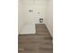 A practical laundry area features durable wood-look flooring and utility connections at 937 Emmer St, Rolesville, NC 27571