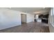 Spacious living room with wood floors that leads into a kitchen at 937 Emmer St, Rolesville, NC 27571