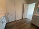 Bathroom featuring wood-look floors, a vanity, and white doors at 98 Willow Cameron Way, Angier, NC 27501