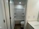 Bathroom view showcases a tub shower combo with white fixtures, plus toilet and vanity with white cabinets at 98 Willow Cameron Way, Angier, NC 27501