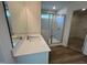 Bathroom featuring a tiled walk-in shower and vanity with a mirror at 98 Willow Cameron Way, Angier, NC 27501