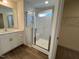 Modern bathroom featuring a tiled shower with glass door and double vanity at 98 Willow Cameron Way, Angier, NC 27501