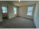Bright bedroom featuring two windows offering natural light and neutral carpeting for a cozy feel at 98 Willow Cameron Way, Angier, NC 27501