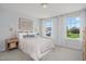 Cozy bedroom with natural light, neutral colors, and a comfortable queen-size bed at 98 Willow Cameron Way, Angier, NC 27501