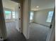 Carpeted bedroom with many windows providing natural light at 98 Willow Cameron Way, Angier, NC 27501