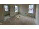 Bright bedroom features fresh paint, modern trim, and windows bringing natural light at 98 Willow Cameron Way, Angier, NC 27501