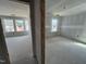 Unfinished bedroom featuring sheetrock, flooring, and natural light from multiple windows at 98 Willow Cameron Way, Angier, NC 27501