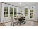 Cozy dining area with natural light, wood floors and decorative rug at 98 Willow Cameron Way, Angier, NC 27501