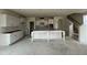 Spacious kitchen showcasing crisp white cabinets, a large island, and ample counter space at 98 Willow Cameron Way, Angier, NC 27501