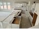 Bright kitchen featuring white cabinetry and a spacious island ready for personalization at 98 Willow Cameron Way, Angier, NC 27501