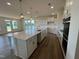 Open-concept kitchen with a large center island and a view of the living area at 98 Willow Cameron Way, Angier, NC 27501