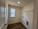 Laundry room featuring vinyl floors, connections, and a window at 98 Willow Cameron Way, Angier, NC 27501
