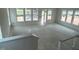 Spacious living room featuring large windows and abundant natural light, great for entertaining at 98 Willow Cameron Way, Angier, NC 27501