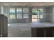 Spacious living room featuring large windows and a glass patio door, under construction at 98 Willow Cameron Way, Angier, NC 27501