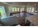 Spacious living room with beautiful hardwood floors and plenty of natural light from the many windows at 98 Willow Cameron Way, Angier, NC 27501