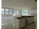 Open-concept living space with large windows, natural light, and prepped kitchen island at 98 Willow Cameron Way, Angier, NC 27501