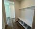 Convenient mudroom area with built-in bench and storage, perfect for organization at 98 Willow Cameron Way, Angier, NC 27501