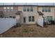 Fenced backyard featuring a patio, utility hookups, and an expansive lawn at 9805 Precious Stone Dr, Wake Forest, NC 27587