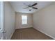 Bedroom with neutral walls, carpet, ceiling fan, and natural light from the window at 9805 Precious Stone Dr, Wake Forest, NC 27587