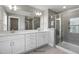 Bathroom featuring double vanity, tile flooring, and a glass-enclosed shower at 53 Merele Dr, Wendell, NC 27591