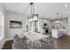 Dining area with stylish lighting, connected to the kitchen for easy entertaining at 53 Merele Dr, Wendell, NC 27591
