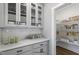 Pantry with white cabinets and shelving offering ample space for storing kitchen essentials at 53 Merele Dr, Wendell, NC 27591