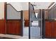Horse stall detail with metal grate, wood paneling, and open door at 1018 Terrell Woods Ln, Chapel Hill, NC 27516
