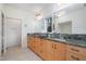 Bathroom with double sinks, granite countertop, and modern fixtures at 1018 Terrell Woods Ln, Chapel Hill, NC 27516