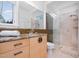 Bathroom featuring a glass shower, vanity, and natural light at 1018 Terrell Woods Ln, Chapel Hill, NC 27516