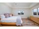 Bright bedroom featuring a natural wood bed frame and colorful area rug at 1018 Terrell Woods Ln, Chapel Hill, NC 27516
