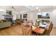 Open-concept dining area with fireplace flows to a living space with ample natural light, ideal for entertaining at 1018 Terrell Woods Ln, Chapel Hill, NC 27516