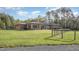 A charming home with a well-manicured lawn and mature trees at 1018 Terrell Woods Ln, Chapel Hill, NC 27516