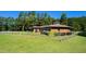 Well-manicured horse farm with fenced paddocks, lush pastures, and mature trees at 1018 Terrell Woods Ln, Chapel Hill, NC 27516