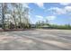Spacious horse arena with a covered gazebo in the background, ideal for training and equestrian activities at 1018 Terrell Woods Ln, Chapel Hill, NC 27516