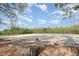 Scenic horse arena with surrounding trees, providing a perfect space for training and equestrian activities at 1018 Terrell Woods Ln, Chapel Hill, NC 27516