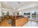 Open concept kitchen with island cooktop that flows into the dining and living room at 1018 Terrell Woods Ln, Chapel Hill, NC 27516