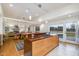 Spacious kitchen boasting a large island with a gas cooktop, flowing into dining and living spaces with ample natural light at 1018 Terrell Woods Ln, Chapel Hill, NC 27516