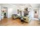 Bright living room featuring hardwood floors, fireplace, and neutral decor at 1018 Terrell Woods Ln, Chapel Hill, NC 27516