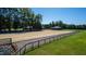 Large riding arena is ready for equestrian pursuits with well-maintained footing at 1018 Terrell Woods Ln, Chapel Hill, NC 27516
