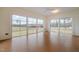 Spacious sunroom with large windows overlooking a scenic yard at 1018 Terrell Woods Ln, Chapel Hill, NC 27516