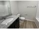 Bathroom featuring granite vanity and bath/shower combo at 111 Magnolia Run Way, Benson, NC 27504