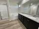 Bathroom featuring a double granite vanity, tub, and separate shower at 111 Magnolia Run Way, Benson, NC 27504